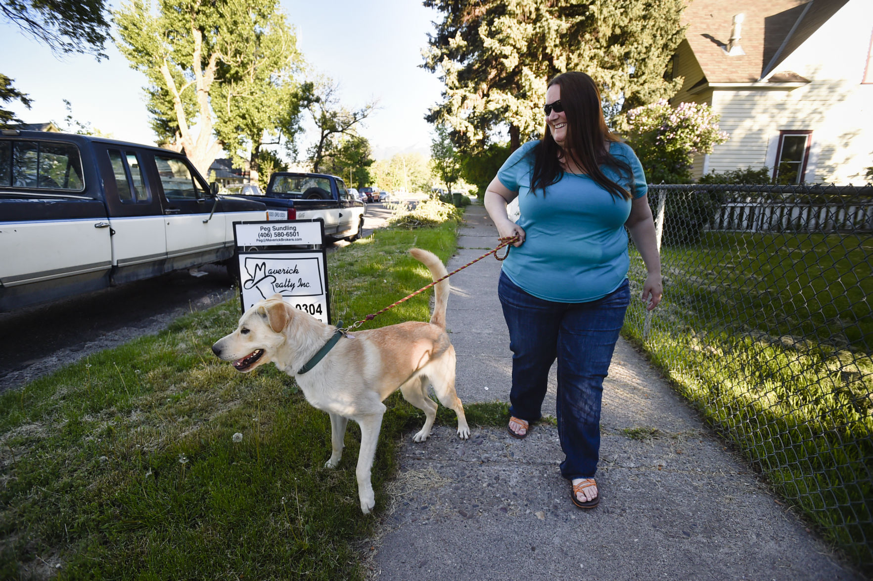 Linda takes Daisy for a walk recently in their Livingston neighborhood.